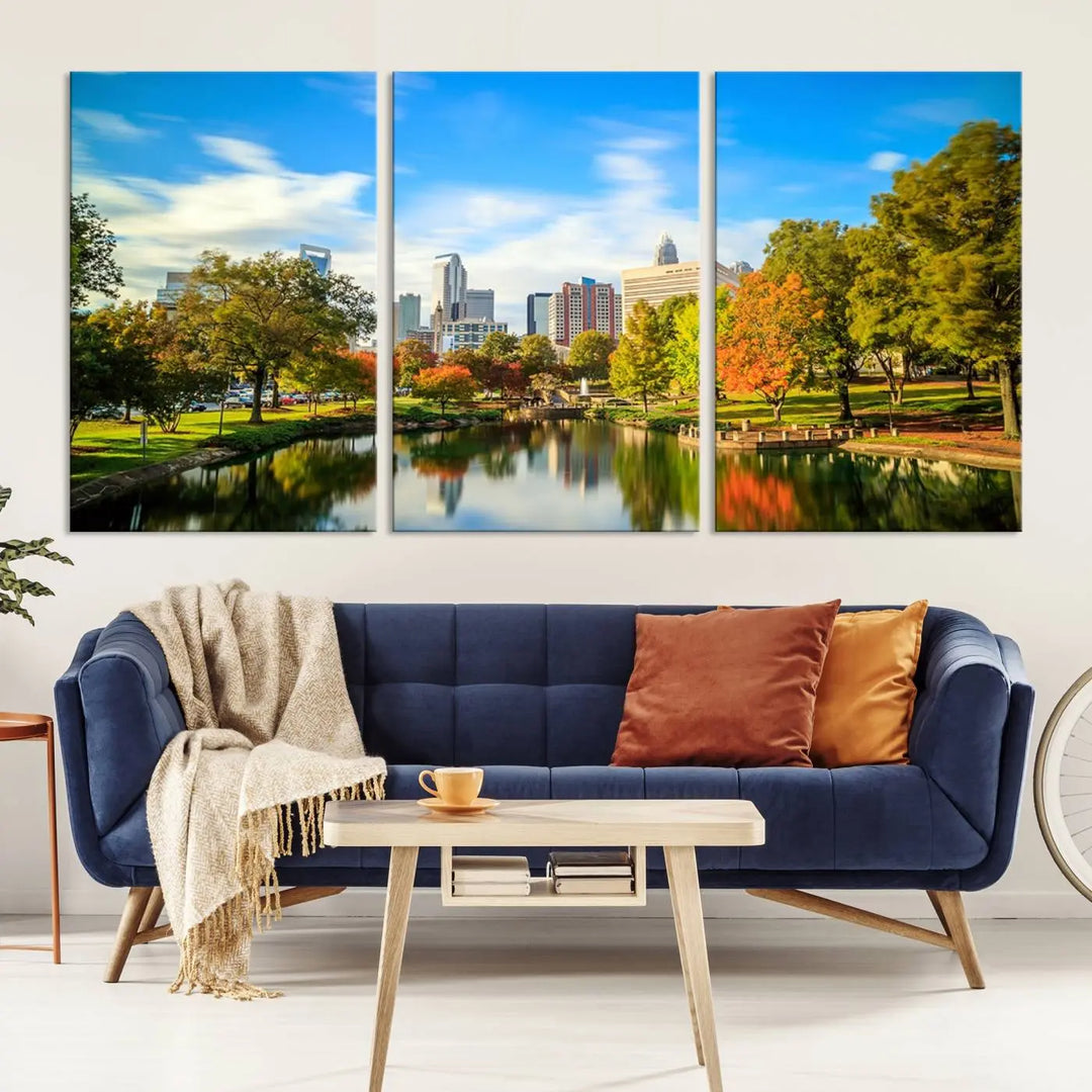 The Charlotte City Park at Spring Skyline Cityscape View wall art canvas print is a triptych featuring a scenic park with a lake and city skyline. It is gallery-wrapped on museum-quality canvases.