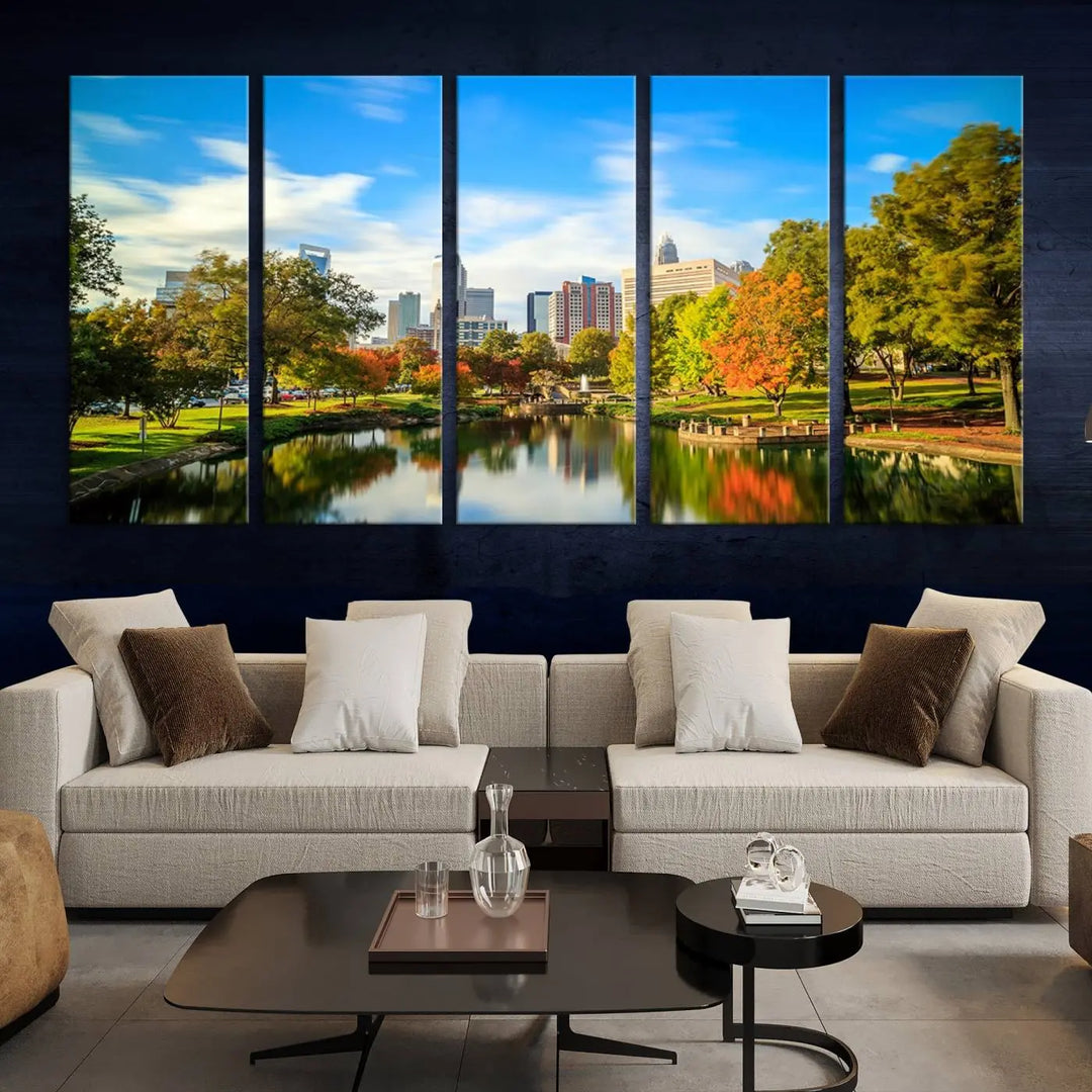 The Charlotte City Park at Spring Skyline Cityscape View wall art canvas print is a triptych featuring a scenic park with a lake and city skyline. It is gallery-wrapped on museum-quality canvases.