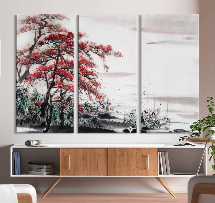 The Cherry Blossom Art Painting Canvas Wall Art, depicting a red tree and abstract landscape on museum-quality canvases, adorns the gray wall. These gallery-wrapped pieces are enhanced with UV-protective coating to preserve their vivid allure.