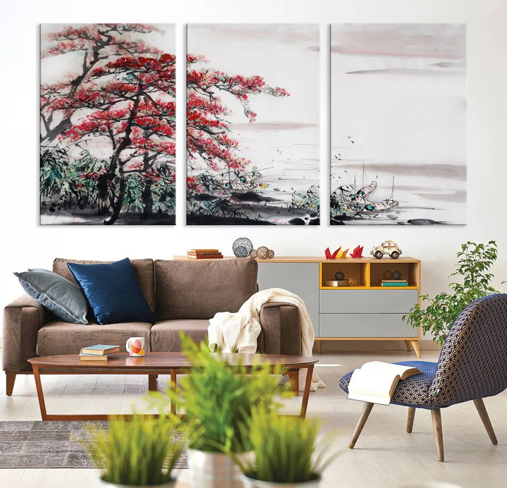 The Cherry Blossom Art Painting Canvas Wall Art, depicting a red tree and abstract landscape on museum-quality canvases, adorns the gray wall. These gallery-wrapped pieces are enhanced with UV-protective coating to preserve their vivid allure.