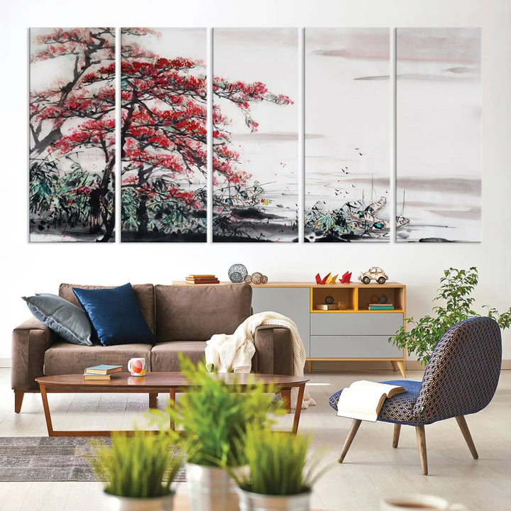 The Cherry Blossom Art Painting Canvas Wall Art, depicting a red tree and abstract landscape on museum-quality canvases, adorns the gray wall. These gallery-wrapped pieces are enhanced with UV-protective coating to preserve their vivid allure.