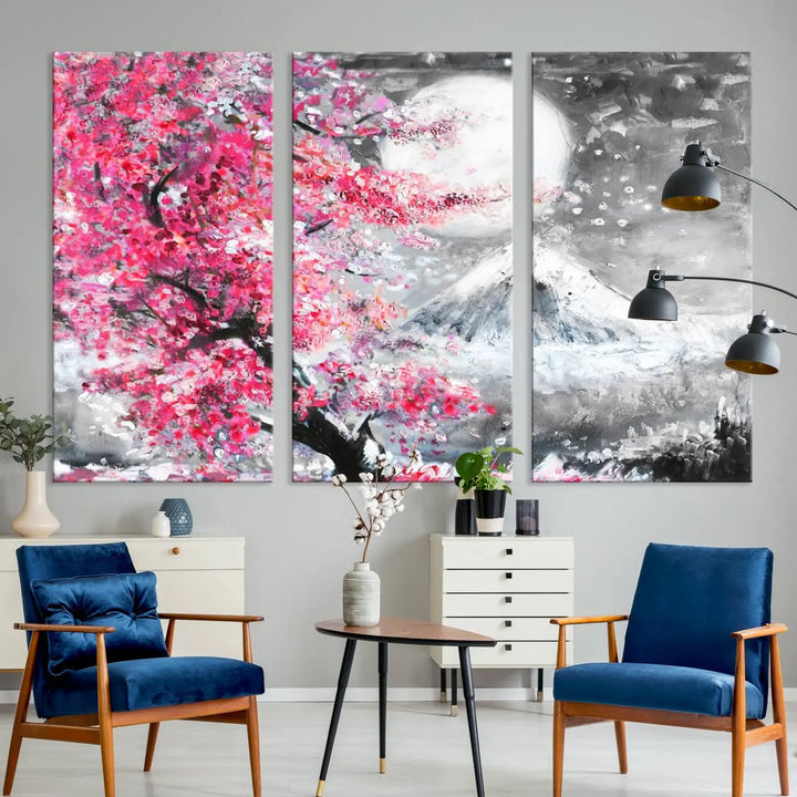 The living room features a striking gallery-wrapped canvas with UV-protective coating, showcasing the "Cherry Blossom Painting Canvas Wall Art Full Moon Art Winter Canvas Art," which depicts a cherry blossom tree with a mountain backdrop.