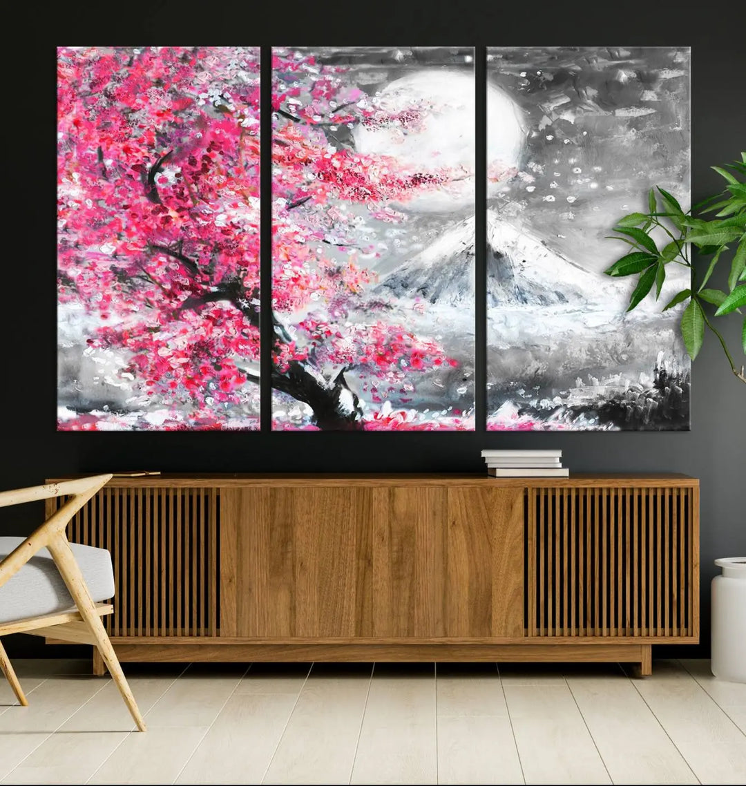 The living room features a striking gallery-wrapped canvas with UV-protective coating, showcasing the "Cherry Blossom Painting Canvas Wall Art Full Moon Art Winter Canvas Art," which depicts a cherry blossom tree with a mountain backdrop.