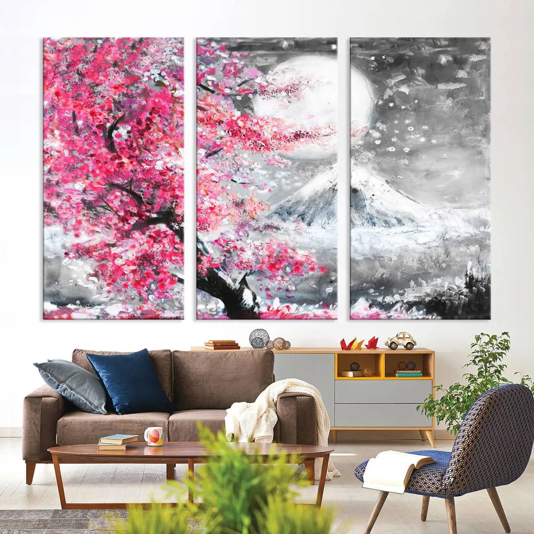 The living room features a striking gallery-wrapped canvas with UV-protective coating, showcasing the "Cherry Blossom Painting Canvas Wall Art Full Moon Art Winter Canvas Art," which depicts a cherry blossom tree with a mountain backdrop.