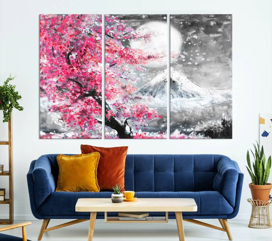 The living room features a striking gallery-wrapped canvas with UV-protective coating, showcasing the "Cherry Blossom Painting Canvas Wall Art Full Moon Art Winter Canvas Art," which depicts a cherry blossom tree with a mountain backdrop.