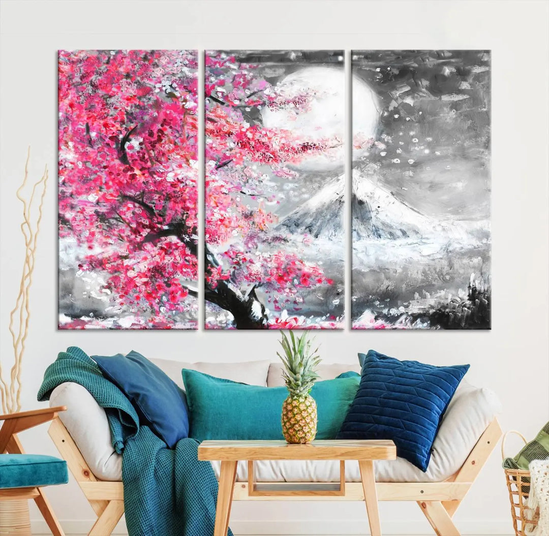 The living room features a striking gallery-wrapped canvas with UV-protective coating, showcasing the "Cherry Blossom Painting Canvas Wall Art Full Moon Art Winter Canvas Art," which depicts a cherry blossom tree with a mountain backdrop.