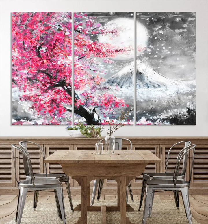 The living room features a striking gallery-wrapped canvas with UV-protective coating, showcasing the "Cherry Blossom Painting Canvas Wall Art Full Moon Art Winter Canvas Art," which depicts a cherry blossom tree with a mountain backdrop.