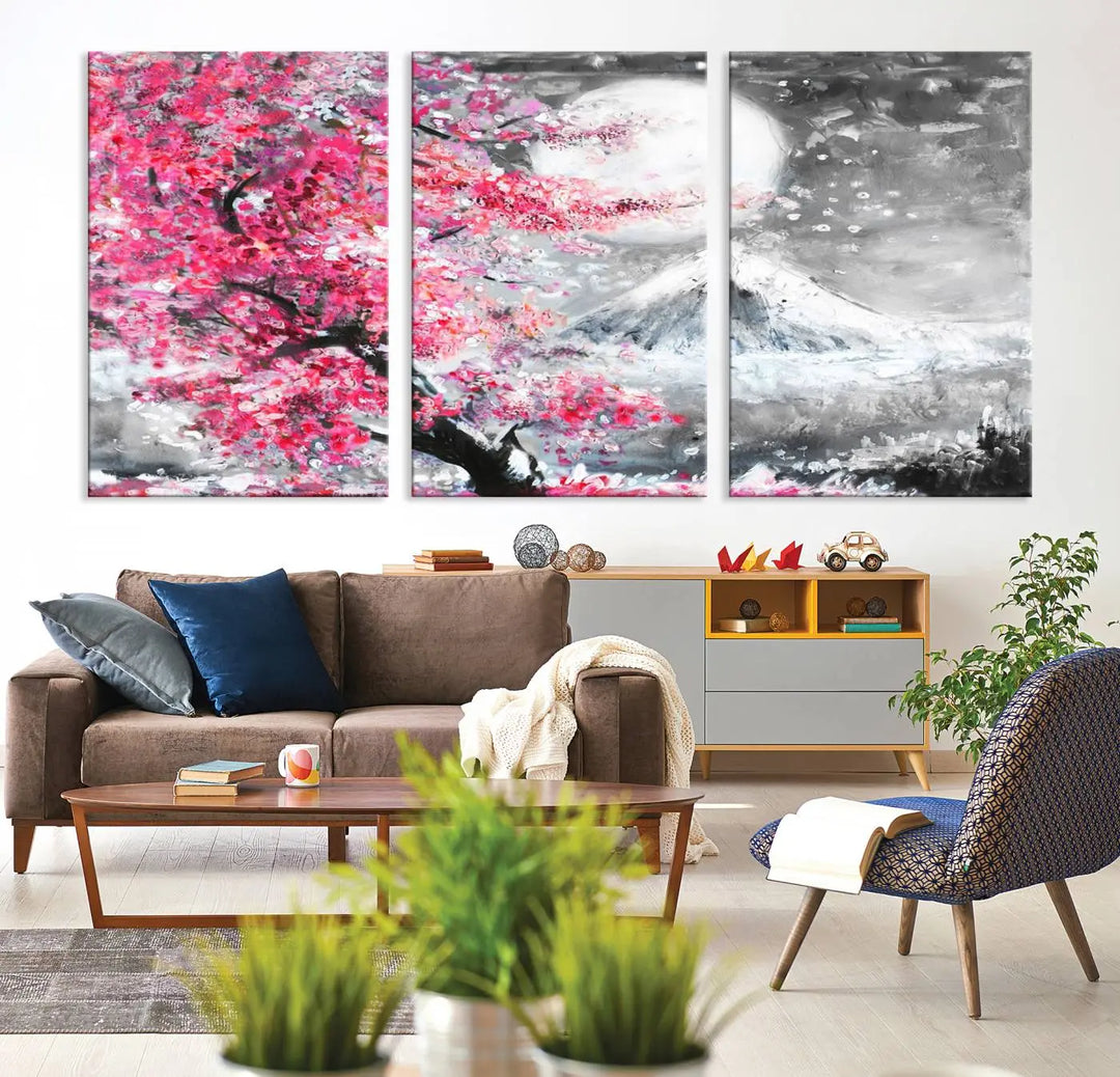 The living room features a striking gallery-wrapped canvas with UV-protective coating, showcasing the "Cherry Blossom Painting Canvas Wall Art Full Moon Art Winter Canvas Art," which depicts a cherry blossom tree with a mountain backdrop.