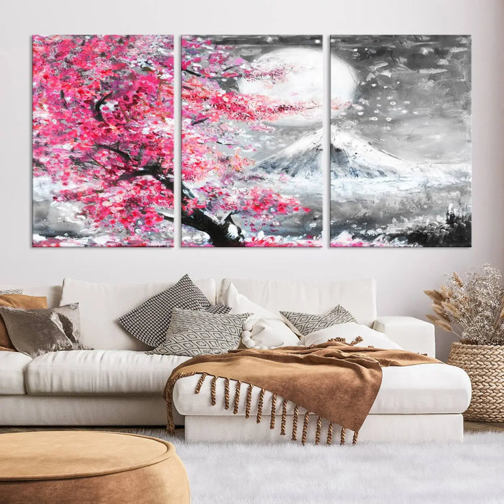 The living room features a striking gallery-wrapped canvas with UV-protective coating, showcasing the "Cherry Blossom Painting Canvas Wall Art Full Moon Art Winter Canvas Art," which depicts a cherry blossom tree with a mountain backdrop.