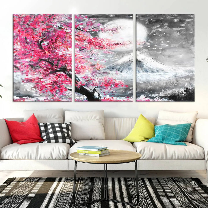 The living room features a striking gallery-wrapped canvas with UV-protective coating, showcasing the "Cherry Blossom Painting Canvas Wall Art Full Moon Art Winter Canvas Art," which depicts a cherry blossom tree with a mountain backdrop.