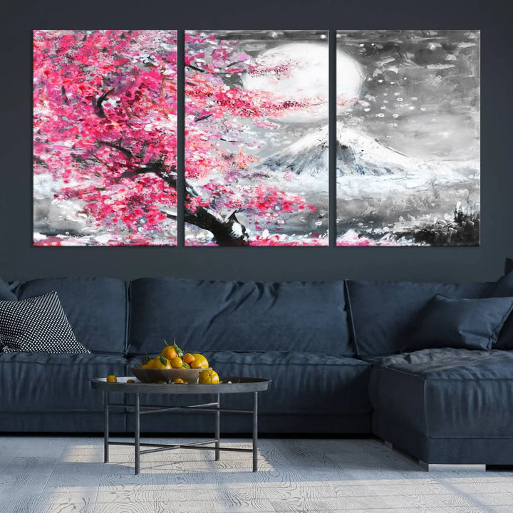 The living room features a striking gallery-wrapped canvas with UV-protective coating, showcasing the "Cherry Blossom Painting Canvas Wall Art Full Moon Art Winter Canvas Art," which depicts a cherry blossom tree with a mountain backdrop.