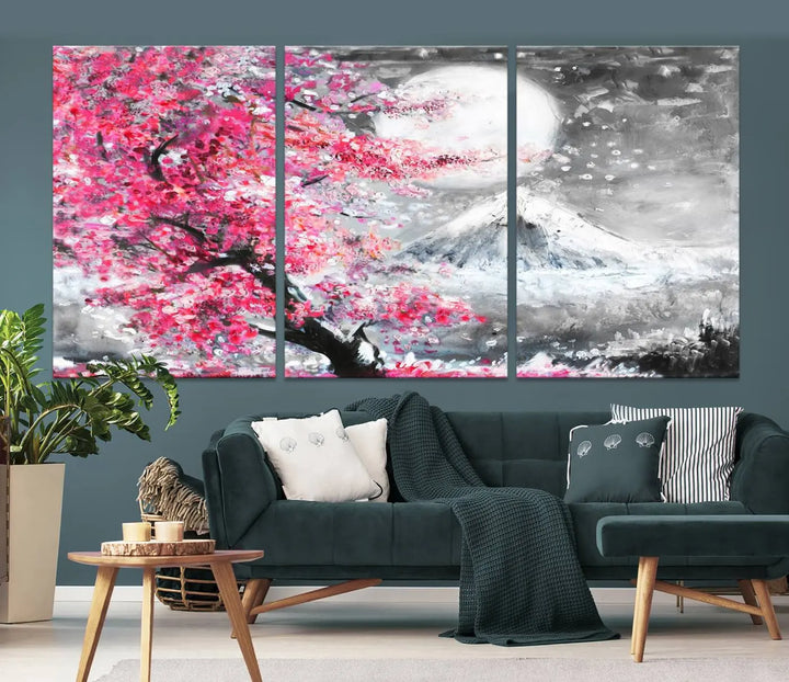 The living room features a striking gallery-wrapped canvas with UV-protective coating, showcasing the "Cherry Blossom Painting Canvas Wall Art Full Moon Art Winter Canvas Art," which depicts a cherry blossom tree with a mountain backdrop.