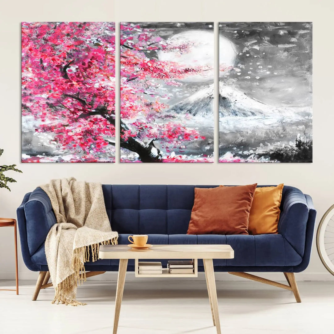 The living room features a striking gallery-wrapped canvas with UV-protective coating, showcasing the "Cherry Blossom Painting Canvas Wall Art Full Moon Art Winter Canvas Art," which depicts a cherry blossom tree with a mountain backdrop.