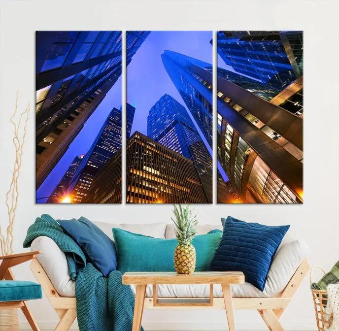 The Chicago Wall Art Canvas Print showcases the cityscape with a breathtaking view from below, featuring skyscrapers illuminated with blue lighting at night. Printed on museum-quality canvas, it arrives ready to hang, adding both style and convenience to your space.