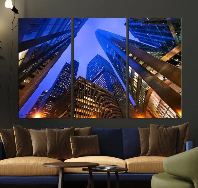 The Chicago Wall Art Canvas Print showcases the cityscape with a breathtaking view from below, featuring skyscrapers illuminated with blue lighting at night. Printed on museum-quality canvas, it arrives ready to hang, adding both style and convenience to your space.