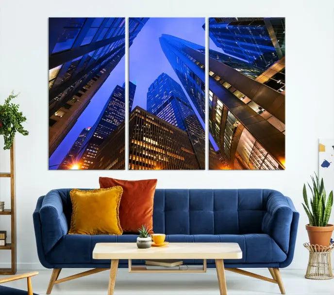 The Chicago Wall Art Canvas Print showcases the cityscape with a breathtaking view from below, featuring skyscrapers illuminated with blue lighting at night. Printed on museum-quality canvas, it arrives ready to hang, adding both style and convenience to your space.