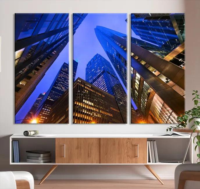 The Chicago Wall Art Canvas Print showcases the cityscape with a breathtaking view from below, featuring skyscrapers illuminated with blue lighting at night. Printed on museum-quality canvas, it arrives ready to hang, adding both style and convenience to your space.