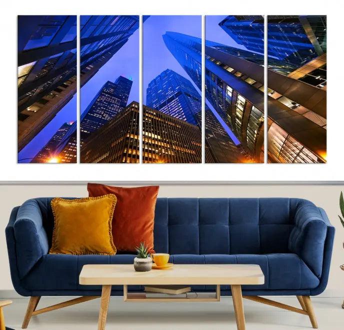 The Chicago Wall Art Canvas Print showcases the cityscape with a breathtaking view from below, featuring skyscrapers illuminated with blue lighting at night. Printed on museum-quality canvas, it arrives ready to hang, adding both style and convenience to your space.