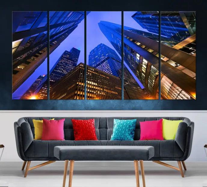 The Chicago Wall Art Canvas Print showcases the cityscape with a breathtaking view from below, featuring skyscrapers illuminated with blue lighting at night. Printed on museum-quality canvas, it arrives ready to hang, adding both style and convenience to your space.