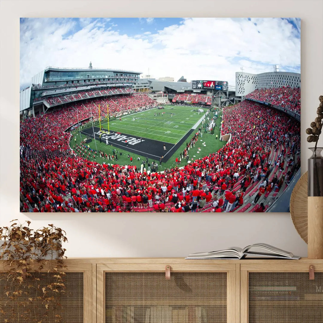 The Cincinnati Bearcats Football Team Print - Nippert Stadium Wall Art Canvas Print showcases a panoramic photo of a packed football stadium with a green field. This high-resolution canvas print provides museum-quality detail, capturing the vibrant energy and atmosphere for everyone to admire.