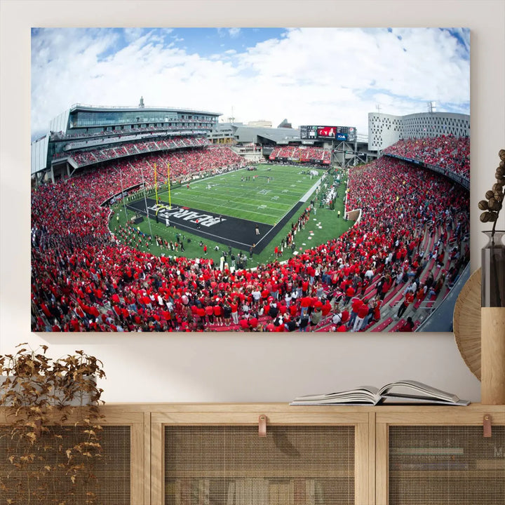 The Cincinnati Bearcats Football Team Print - Nippert Stadium Wall Art Canvas Print showcases a panoramic photo of a packed football stadium with a green field. This high-resolution canvas print provides museum-quality detail, capturing the vibrant energy and atmosphere for everyone to admire.