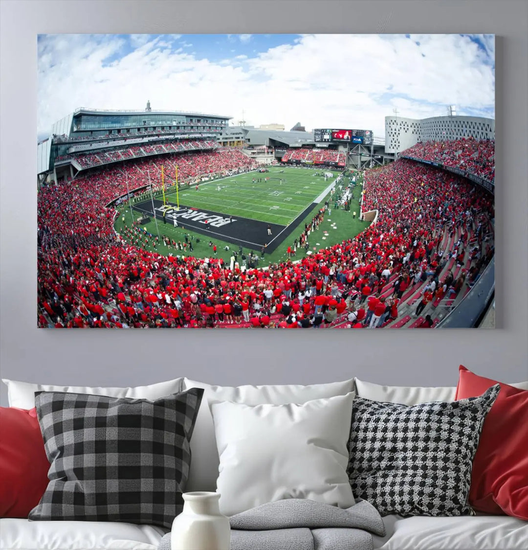 The Cincinnati Bearcats Football Team Print - Nippert Stadium Wall Art Canvas Print showcases a panoramic photo of a packed football stadium with a green field. This high-resolution canvas print provides museum-quality detail, capturing the vibrant energy and atmosphere for everyone to admire.