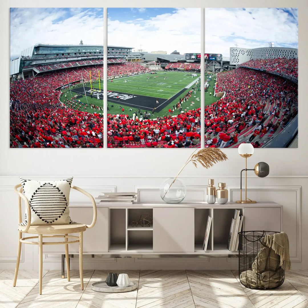 The Cincinnati Bearcats Football Team Print - Nippert Stadium Wall Art Canvas Print showcases a panoramic photo of a packed football stadium with a green field. This high-resolution canvas print provides museum-quality detail, capturing the vibrant energy and atmosphere for everyone to admire.