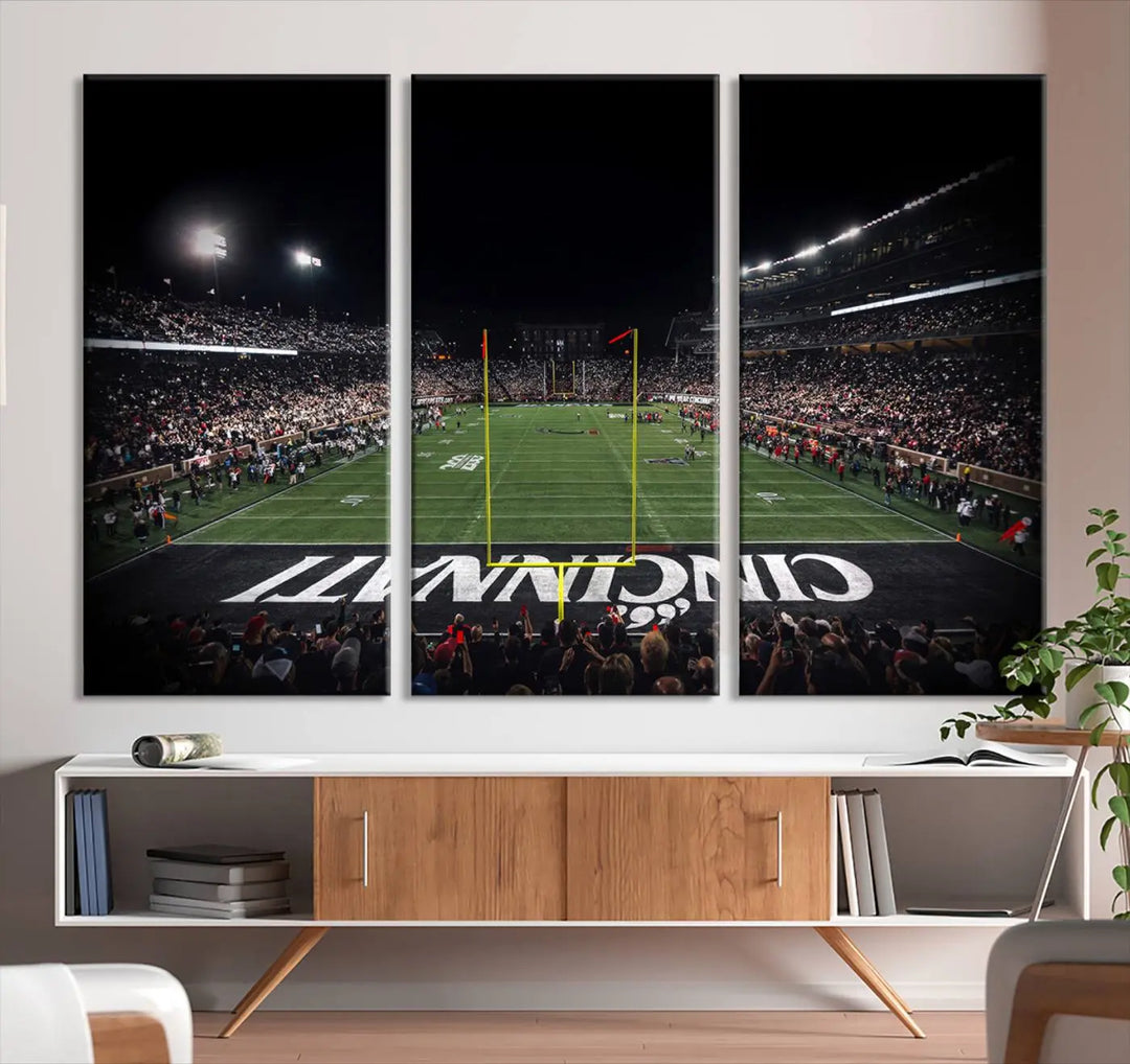 The Cincinnati Bearcats Football Team Print - Nippert Stadium Wall Art Canvas captures a panoramic view of the football stadium at night, offering museum-quality presentation. The vibrant colors and high-resolution printing bring every detail to life.