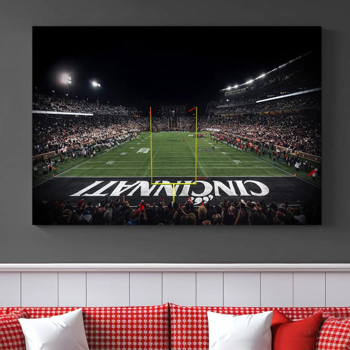 The Cincinnati Bearcats Football Team Print - Nippert Stadium Wall Art Canvas captures a panoramic view of the football stadium at night, offering museum-quality presentation. The vibrant colors and high-resolution printing bring every detail to life.