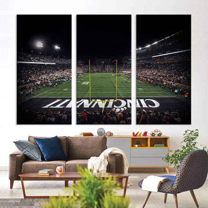 The Cincinnati Bearcats Football Team Print - Nippert Stadium Wall Art Canvas captures a panoramic view of the football stadium at night, offering museum-quality presentation. The vibrant colors and high-resolution printing bring every detail to life.