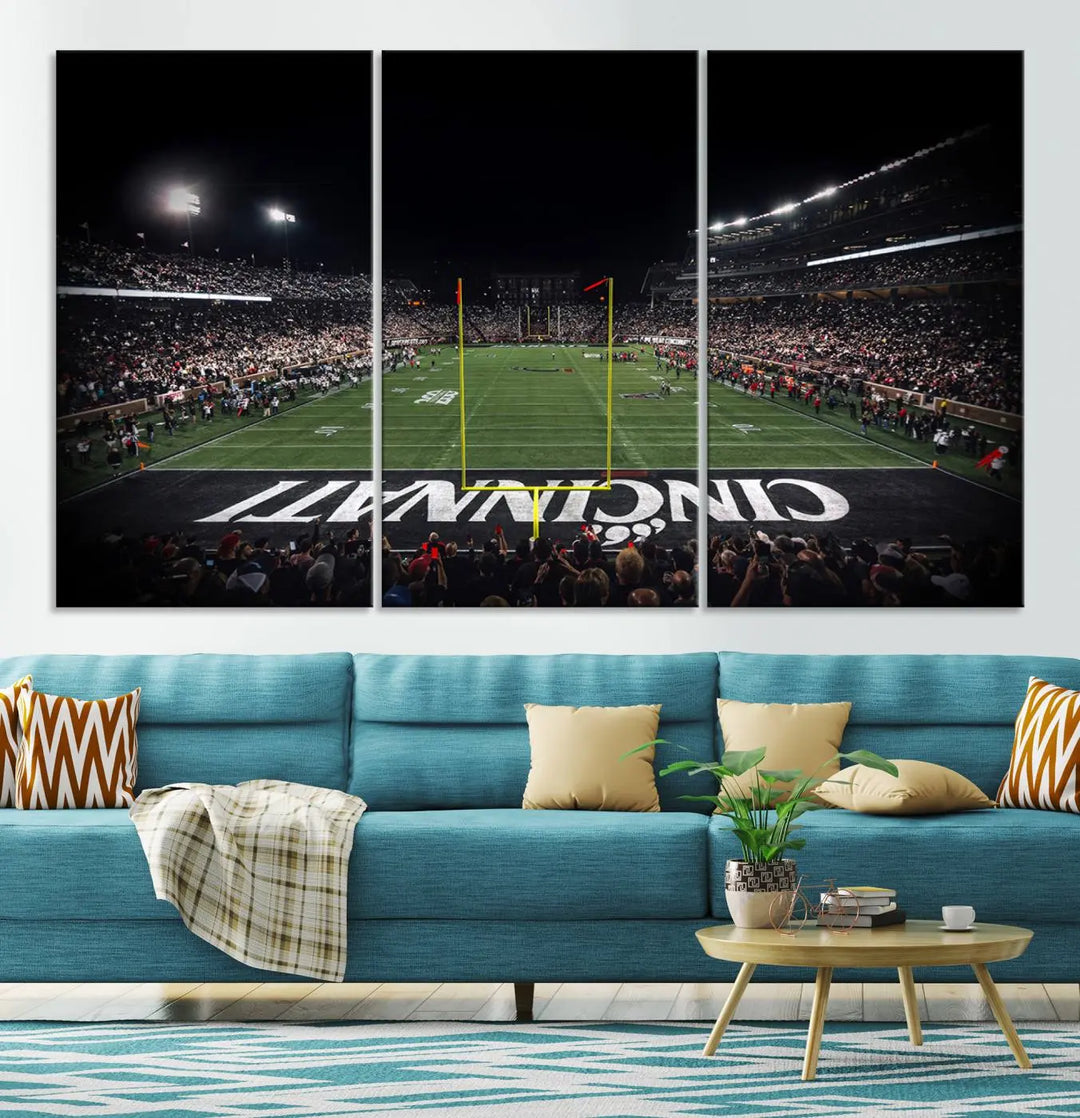 The Cincinnati Bearcats Football Team Print - Nippert Stadium Wall Art Canvas captures a panoramic view of the football stadium at night, offering museum-quality presentation. The vibrant colors and high-resolution printing bring every detail to life.