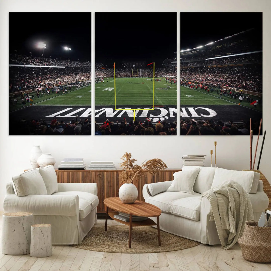 The Cincinnati Bearcats Football Team Print - Nippert Stadium Wall Art Canvas captures a panoramic view of the football stadium at night, offering museum-quality presentation. The vibrant colors and high-resolution printing bring every detail to life.