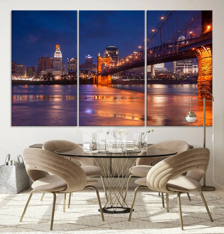 The Cincinnati City Bridge Lights Night Skyline Cityscape View Wall Art Canvas Print is a magnificent triptych crafted on museum-quality polycotton canvas. It features a beautifully illuminated bridge over water at night, enhancing any living room with its elegant design.