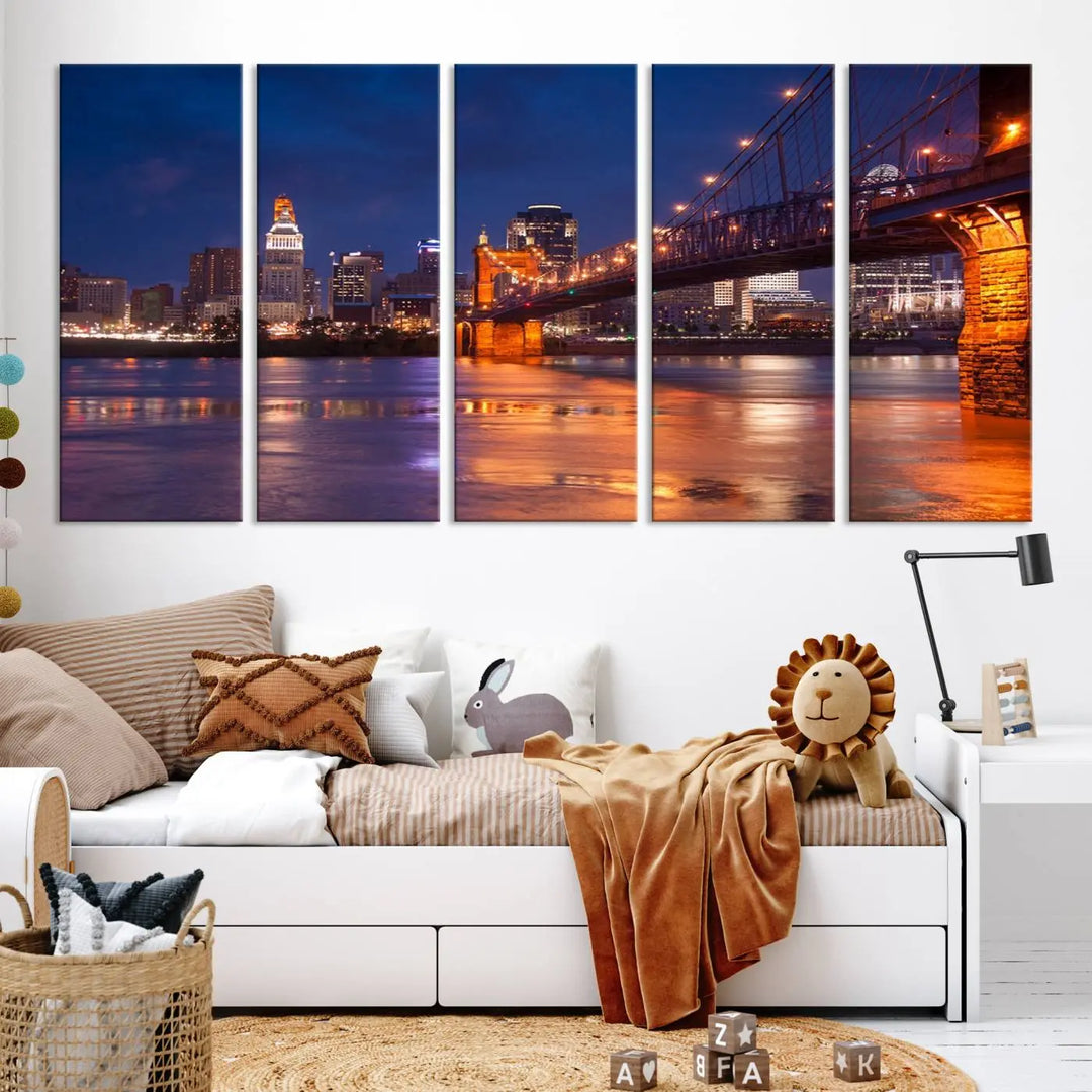 The Cincinnati City Bridge Lights Night Skyline Cityscape View Wall Art Canvas Print is a magnificent triptych crafted on museum-quality polycotton canvas. It features a beautifully illuminated bridge over water at night, enhancing any living room with its elegant design.