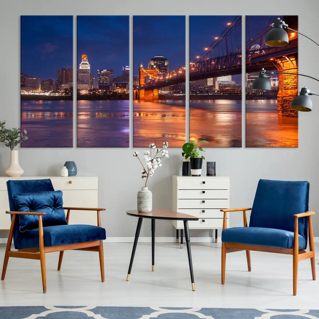 The Cincinnati City Bridge Lights Night Skyline Cityscape View Wall Art Canvas Print is a magnificent triptych crafted on museum-quality polycotton canvas. It features a beautifully illuminated bridge over water at night, enhancing any living room with its elegant design.