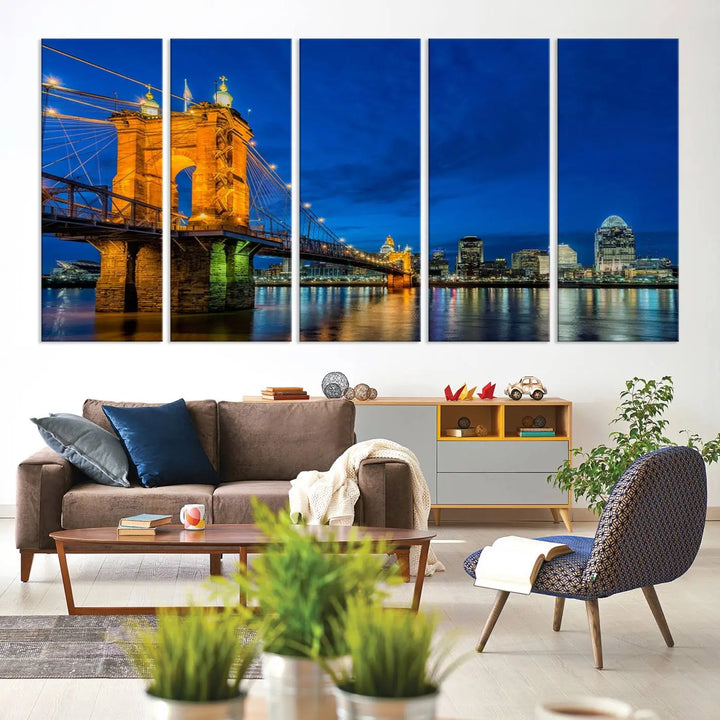 The living room features a museum-quality, multi-panel wall art titled "Cincinnati City Bridge Lights Night Skyline Cityscape View Wall Art Canvas Print," which depicts a lit-up bridge at night. The gallery-wrapped canvas adds a touch of elegance to the space.