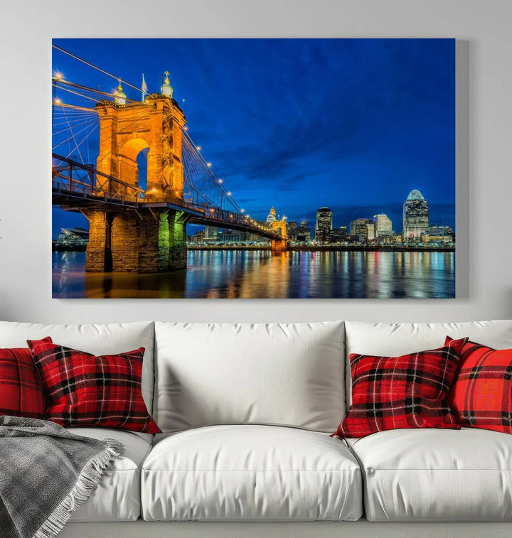 The living room features a museum-quality, multi-panel wall art titled "Cincinnati City Bridge Lights Night Skyline Cityscape View Wall Art Canvas Print," which depicts a lit-up bridge at night. The gallery-wrapped canvas adds a touch of elegance to the space.