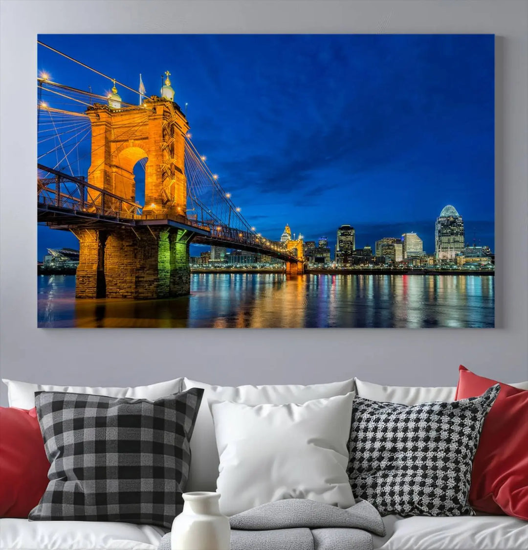 The living room features a museum-quality, multi-panel wall art titled "Cincinnati City Bridge Lights Night Skyline Cityscape View Wall Art Canvas Print," which depicts a lit-up bridge at night. The gallery-wrapped canvas adds a touch of elegance to the space.