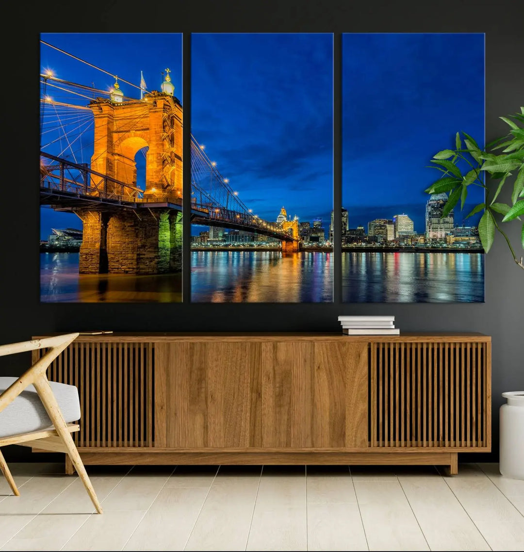 The living room features a museum-quality, multi-panel wall art titled "Cincinnati City Bridge Lights Night Skyline Cityscape View Wall Art Canvas Print," which depicts a lit-up bridge at night. The gallery-wrapped canvas adds a touch of elegance to the space.