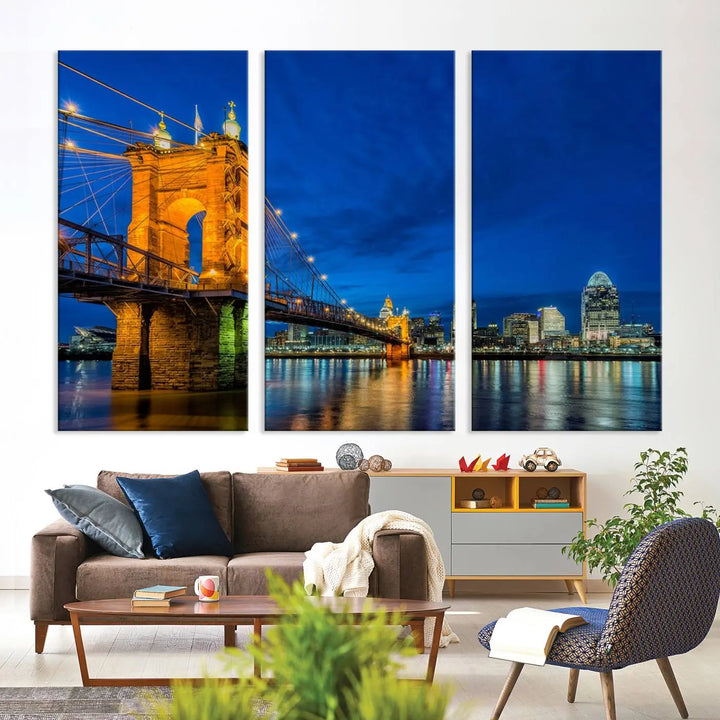 The living room features a museum-quality, multi-panel wall art titled "Cincinnati City Bridge Lights Night Skyline Cityscape View Wall Art Canvas Print," which depicts a lit-up bridge at night. The gallery-wrapped canvas adds a touch of elegance to the space.