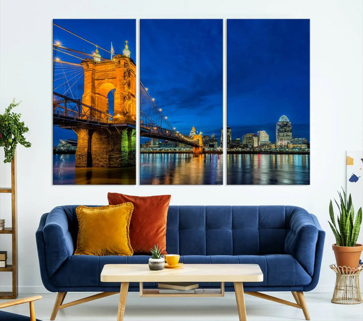 The living room features a museum-quality, multi-panel wall art titled "Cincinnati City Bridge Lights Night Skyline Cityscape View Wall Art Canvas Print," which depicts a lit-up bridge at night. The gallery-wrapped canvas adds a touch of elegance to the space.