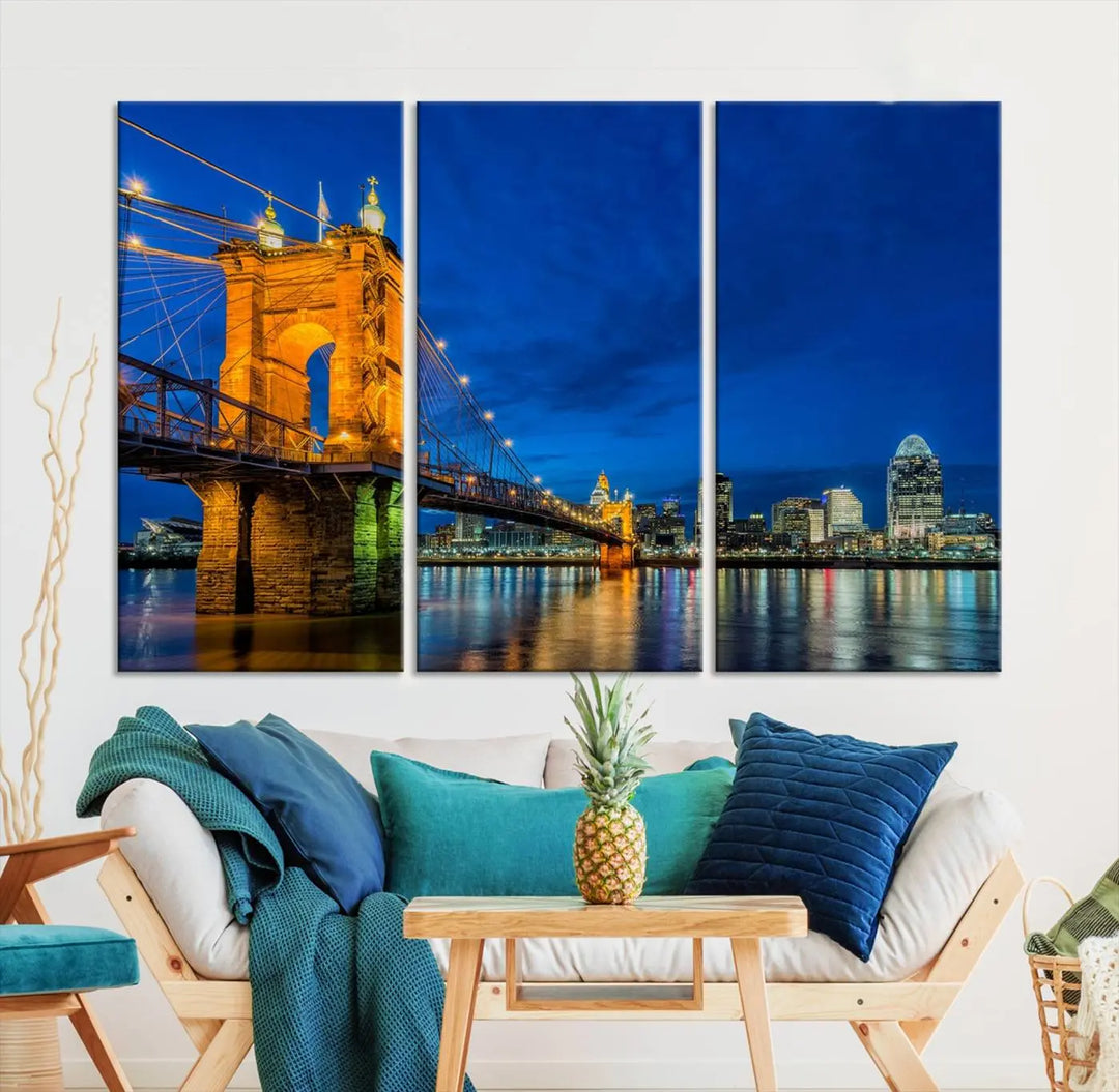 The living room features a museum-quality, multi-panel wall art titled "Cincinnati City Bridge Lights Night Skyline Cityscape View Wall Art Canvas Print," which depicts a lit-up bridge at night. The gallery-wrapped canvas adds a touch of elegance to the space.