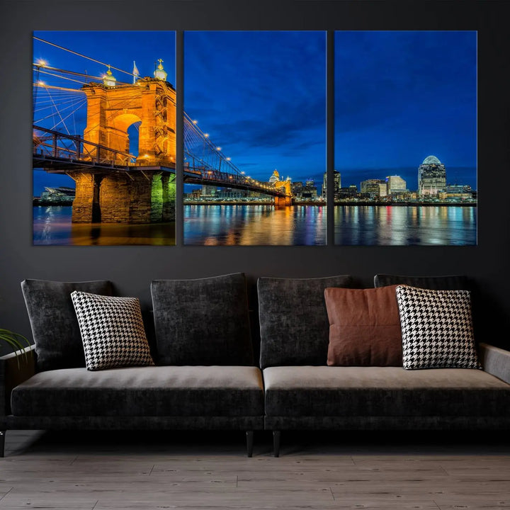 The living room features a museum-quality, multi-panel wall art titled "Cincinnati City Bridge Lights Night Skyline Cityscape View Wall Art Canvas Print," which depicts a lit-up bridge at night. The gallery-wrapped canvas adds a touch of elegance to the space.