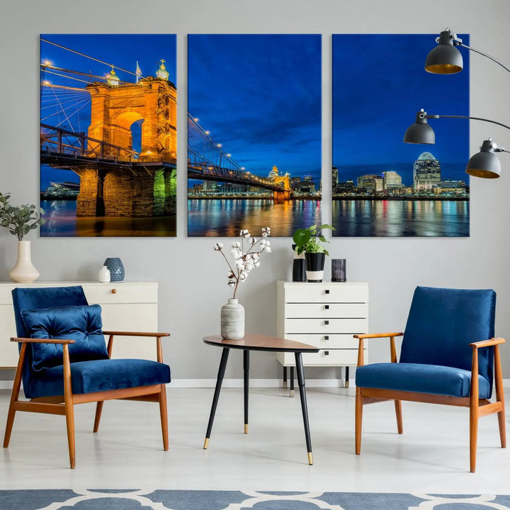 The living room features a museum-quality, multi-panel wall art titled "Cincinnati City Bridge Lights Night Skyline Cityscape View Wall Art Canvas Print," which depicts a lit-up bridge at night. The gallery-wrapped canvas adds a touch of elegance to the space.