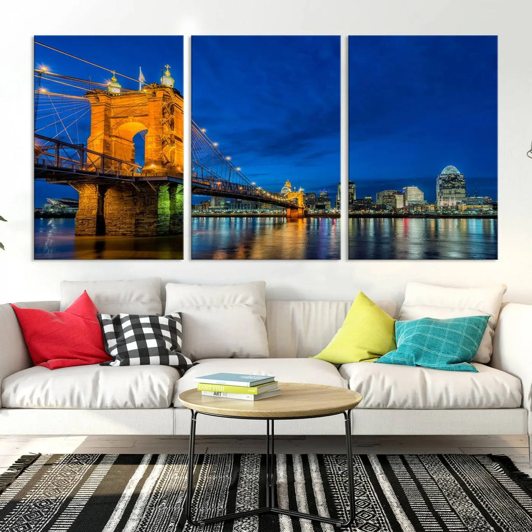 The living room features a museum-quality, multi-panel wall art titled "Cincinnati City Bridge Lights Night Skyline Cityscape View Wall Art Canvas Print," which depicts a lit-up bridge at night. The gallery-wrapped canvas adds a touch of elegance to the space.