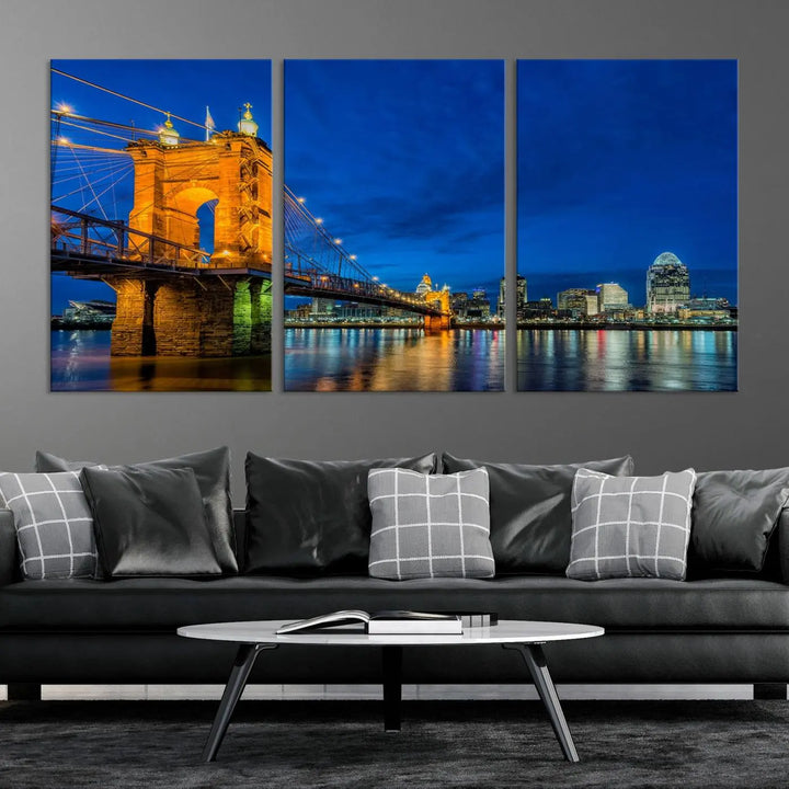 The living room features a museum-quality, multi-panel wall art titled "Cincinnati City Bridge Lights Night Skyline Cityscape View Wall Art Canvas Print," which depicts a lit-up bridge at night. The gallery-wrapped canvas adds a touch of elegance to the space.