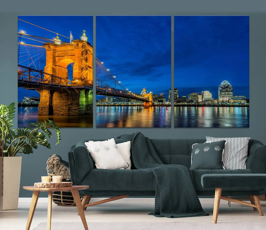 The living room features a museum-quality, multi-panel wall art titled "Cincinnati City Bridge Lights Night Skyline Cityscape View Wall Art Canvas Print," which depicts a lit-up bridge at night. The gallery-wrapped canvas adds a touch of elegance to the space.