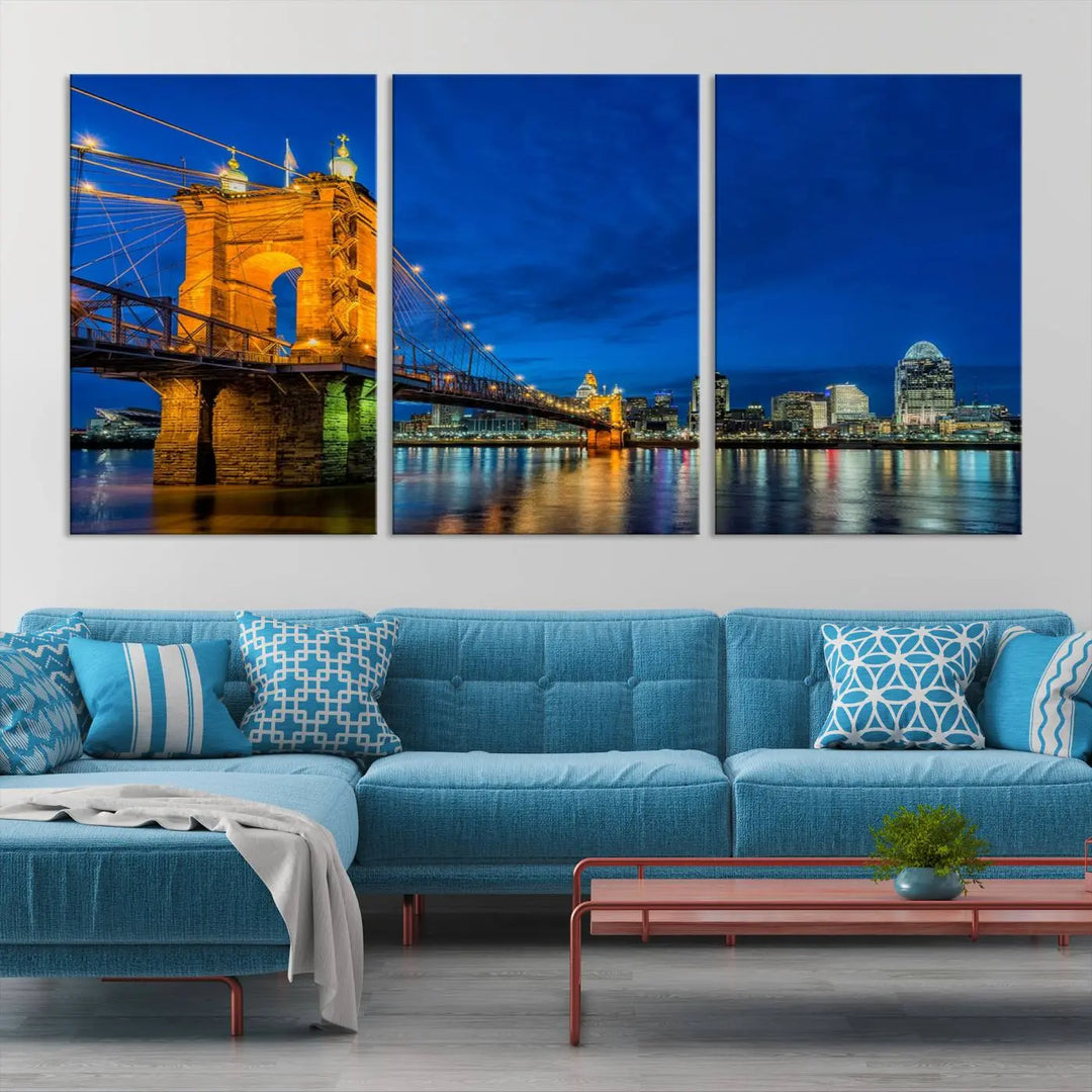 The living room features a museum-quality, multi-panel wall art titled "Cincinnati City Bridge Lights Night Skyline Cityscape View Wall Art Canvas Print," which depicts a lit-up bridge at night. The gallery-wrapped canvas adds a touch of elegance to the space.