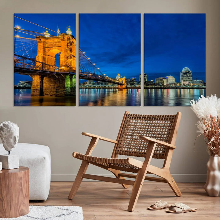 The living room features a museum-quality, multi-panel wall art titled "Cincinnati City Bridge Lights Night Skyline Cityscape View Wall Art Canvas Print," which depicts a lit-up bridge at night. The gallery-wrapped canvas adds a touch of elegance to the space.