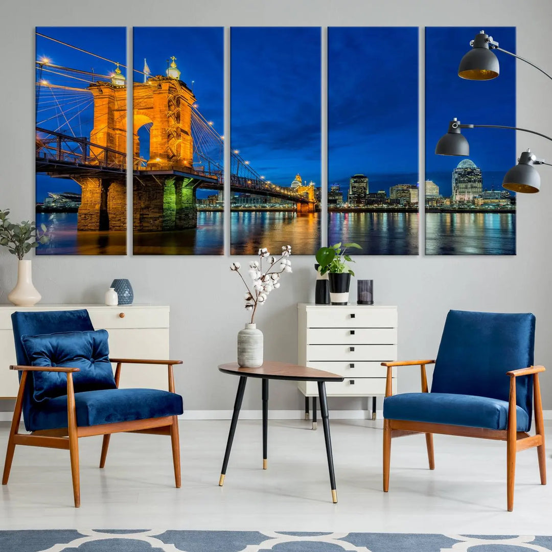 The living room features a museum-quality, multi-panel wall art titled "Cincinnati City Bridge Lights Night Skyline Cityscape View Wall Art Canvas Print," which depicts a lit-up bridge at night. The gallery-wrapped canvas adds a touch of elegance to the space.